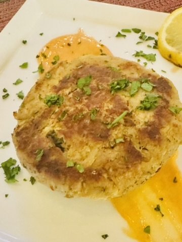 Golden lump crab cake with citrus aioli and lemon